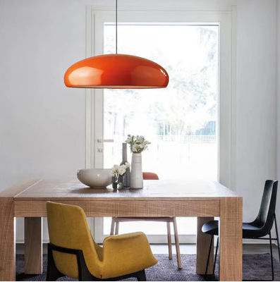 Modern pendant lighting above dining table